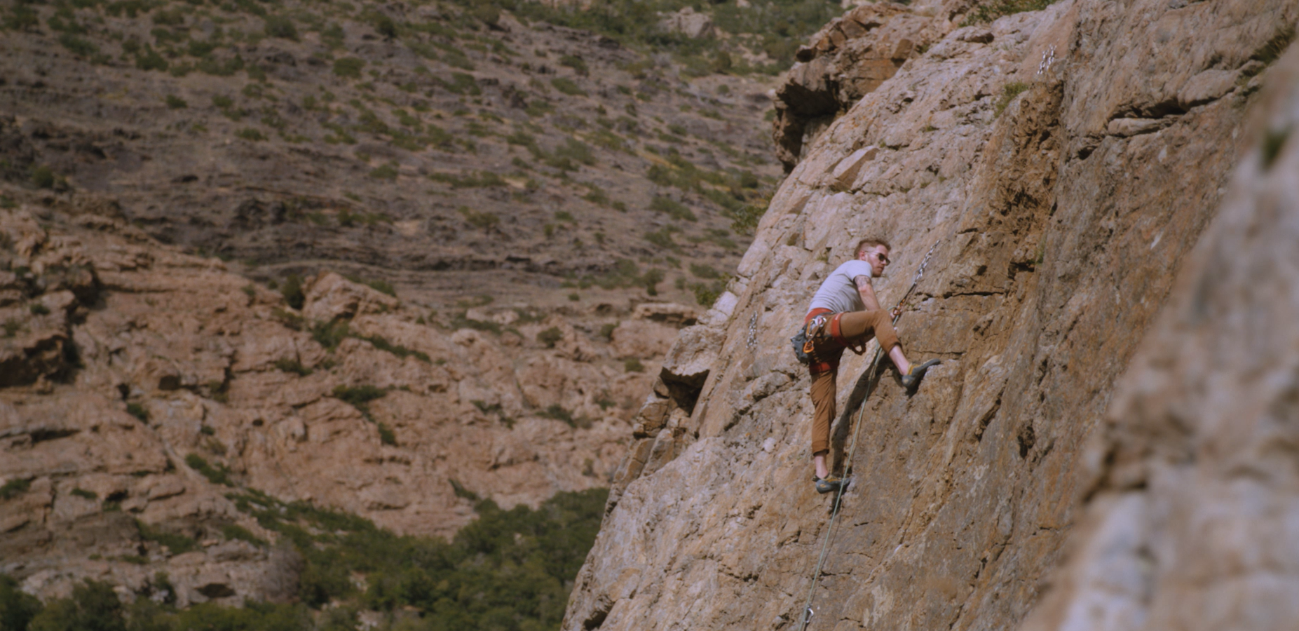 Rock climber on a canyon face, film still